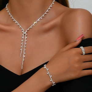 Elegant rhinestone jewelry set with Y-shaped tassel necklace, bracelet and ring on model