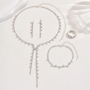 Silver fringe jewelry set with sparkling rhinestones including necklace and earrings