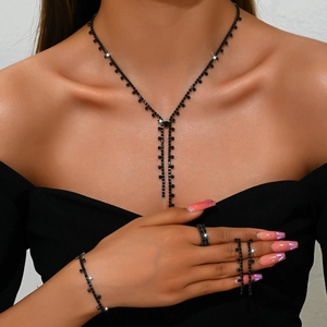 Elegant bridal jewelry set with black rhinestones including necklace, bracelet and ring