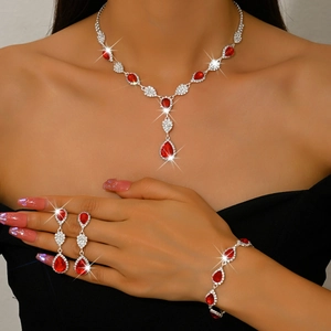 Detail view of ruby red drop crystal jewelry set with sparkling silver rhinestones