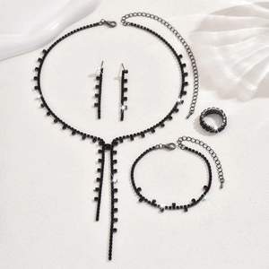 Elegant four-piece black rhinestone jewelry set with long tassel necklace and drop earrings