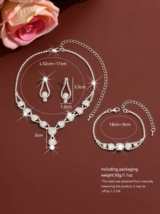 Detailed view of silver bridal jewelry set with necklace, earrings and bracelet dimensions