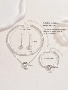 Detail view of heart-shaped crystal jewelry set with necklace bracelet and earrings