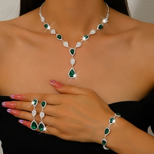Detail of luxury emerald green crystal bridal jewelry set with necklace and earrings