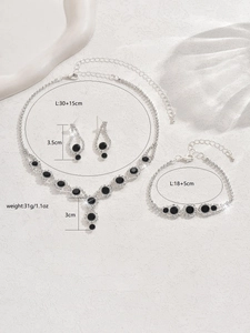 Detailed view of silver jewelry set dimensions with black stones and weights