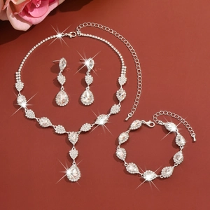 Detailed view of shimmering crystal bridal jewelry set with necklace earrings and bracelet