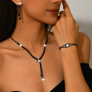 Three-piece black tassel jewelry set with rhinestone necklace, bracelet and earrings