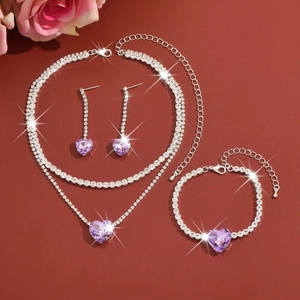 Detailed set of purple heart crystal jewelry with necklace, earrings, and bracelet