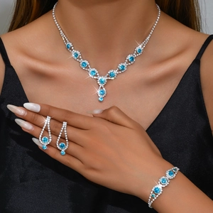 Elegant 3-piece silver jewelry set with blue rhinestones including necklace and earrings