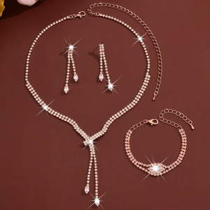 Detailed set featuring sparkling rhinestone fringe necklace with matching bracelet and earrings
