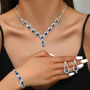 Elegant bridal jewelry set with navy blue stones and diamonds on model for weddings