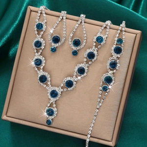 Sparkling bridal jewelry set with deep blue gemstones and white rhinestones in gift box