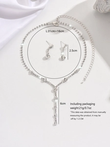 Detailed view of silver rhinestone necklace and drop earrings with precise dimensions
