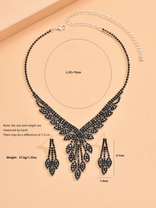 Detail of elegant black crystal necklace and drop earrings set for wedding jewelry