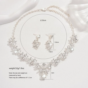 Macro detail of silver wedding jewelry set with crystal marquise leaf designs and measurements