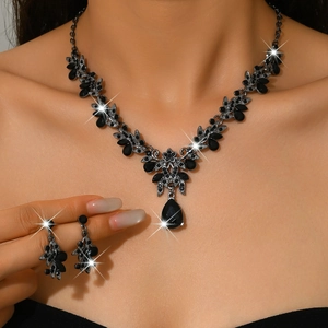 Detail of gothic black rhinestone bridal jewelry set with pear-shaped pendant and earrings