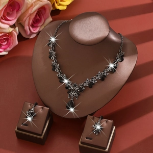 Elegant silver alloy necklace and earring set with teardrop black gemstones for brides