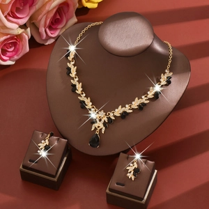Luxurious bridal jewelry set with black gemstones and crystals on vine necklace