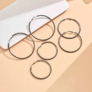Black gunmetal hoop earring set with sparkling dark rhinestones in various sizes