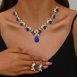 Elegant bridal jewelry set with royal blue gems and gold necklace and earrings for women