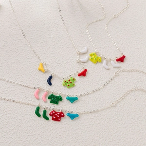 Chic silver layered necklaces with colorful enamel t-shirt, sock, and shorts pendants