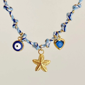 Collana in corda intrecciata marina con stella marina dorata e ciondolo malocchio