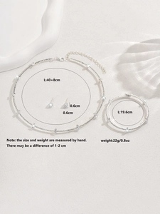 Detailed size chart of rhinestone necklace, bracelet, and earring set with measurements