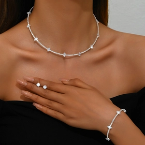 Detail of silver crystal necklace and bracelet set with marquise cut stones on model