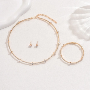 Detail of elegant gold crystal necklace bracelet and earrings jewelry set for women