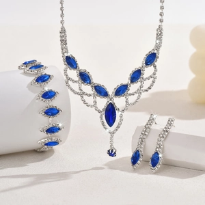 Detail showing bridal jewelry set with sapphire blue marquise crystals and tiny diamonds