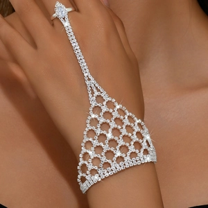 Close-up of sparkling silver hand harness with rhinestone mesh and marquise stone ring