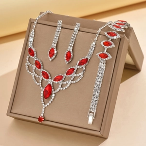 Detail of red teardrop gemstone bridal jewelry set with sparkling micro-pave crystals