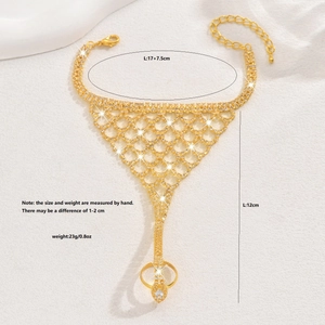 Detail view of gold mesh slave bracelet with rhinestone mesh and dimension markers