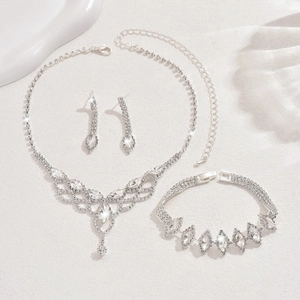 Elegant silver bridal jewelry set with water-drop mesh necklace, bracelet, and earrings