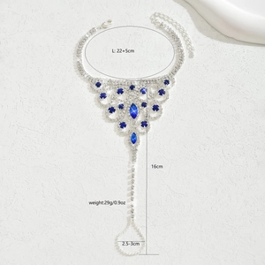 Detail view of silver rhinestone slave bracelet with blue gems and dimension markings