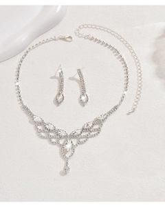 Detail of silver drop necklace set with shimmering rhinestones and V-shape pendant