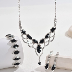 Macro detail of bridal jewelry set with silver base and sparkling black teardrop stones