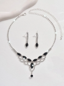Detail view of water drop mesh necklace and earrings set with black marquise stones
