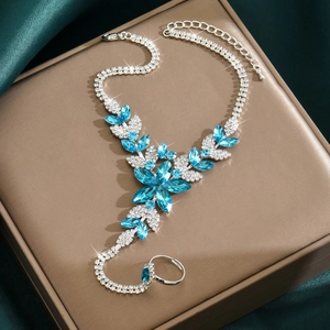 Elegant silver leaf finger bracelet with blue marquise crystals and sparkling rhinestones