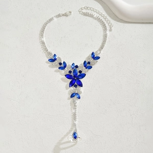 Macro detail of silver flower slave bracelet with royal blue marquise stones and crystals