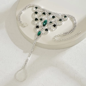 Bohemian silver slave bracelet featuring emerald green marquise gems and rhinestones