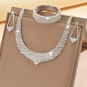 Elegant bridal jewelry set with V-shaped rhinestone necklace and droplet earrings