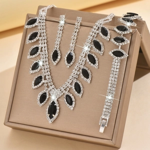 Detail of bridal jewelry set with black marquise stones and crystals in a box
