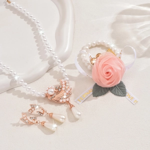 Detailed view of floral pearl necklace and rose bracelet set for bridal wear