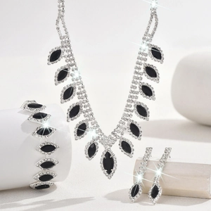 Detailed view of silver bridal jewelry set with black marquise stones and white crystal halo