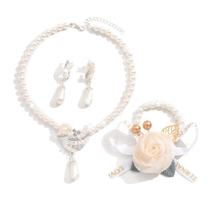 Elegant pearl jewelry set with flower bracelet and bird pendant necklace for bridal wear