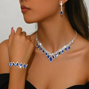 Detailed macro view of bridal jewelry set with navy blue stones and white crystals