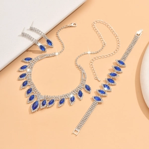 Detailed macro view of bridal jewelry set with navy blue marquise crystals and silver finish