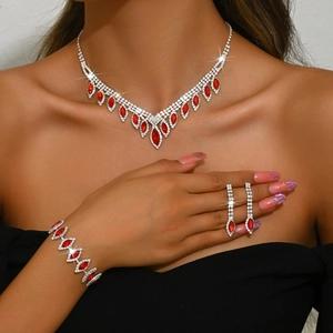 Luxurious bridal jewelry set with red marquise gemstones and white crystals on a silver base