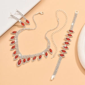 Detail of silver bridal jewelry set with red marquise stones and clear rhinestones
